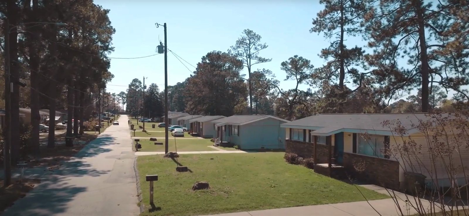 Exterior of The Mill Gardens Apartments — a family-friendly community zoned for Veterans High School in Kathleen, GA